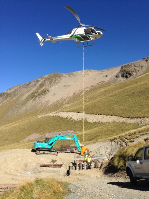 Helicopter bringing in concrete for the Triple Chair columns