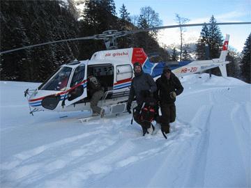Helicopter waiting in powder field at 1100 metres