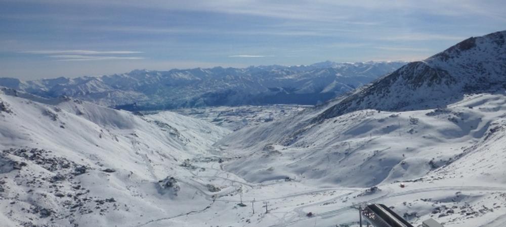 The stunning view of The Remarkables ski area from Curvey Basin looking down to the valley below